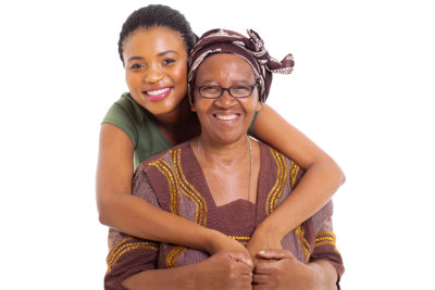 pretty african daughter hugging senior mother