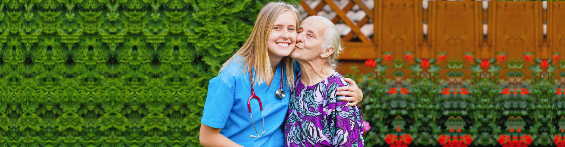 senior kisses caregiver woman